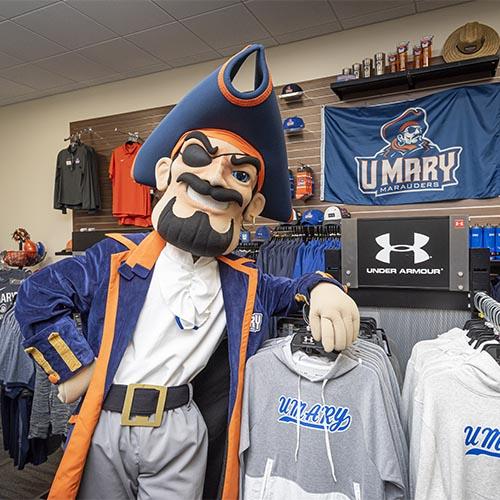Max the Marauder with University of Mary apparel in the bookstore.