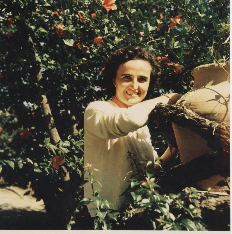 The iconic photo of St. Gianna Beretta Molla in her garden.