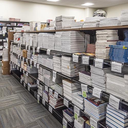 Textbooks on the shelves in the University of Mary bookstore.