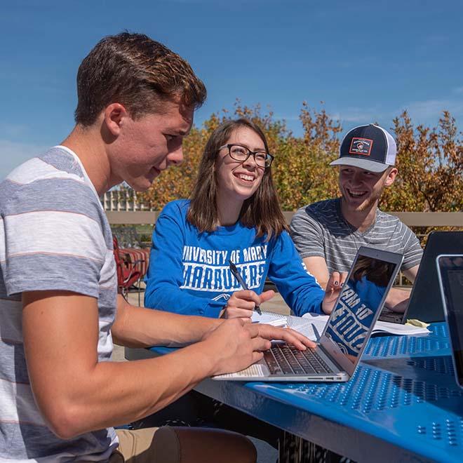 Peer tutoring group studying outside