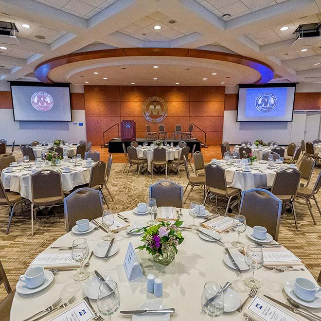 Tables set up for a banquet in Founders Hall