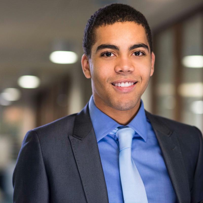 Headshot of smiling well-dressed employee