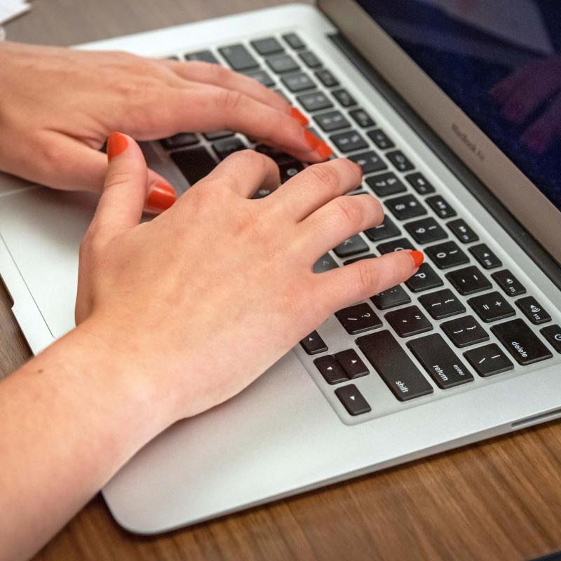 Closeup of hands on a keyboard 