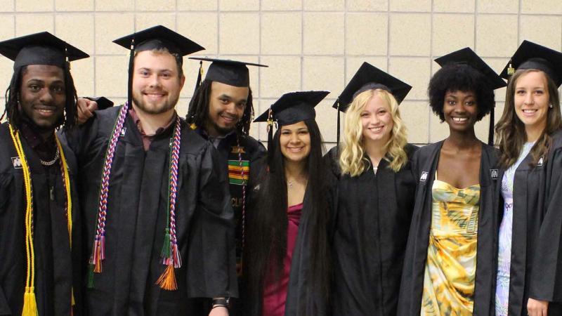 Smiling diverse group of TRIO students at graduation