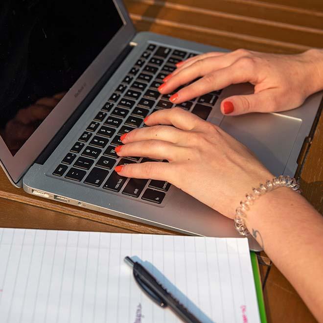 Closeup of hands on laptop