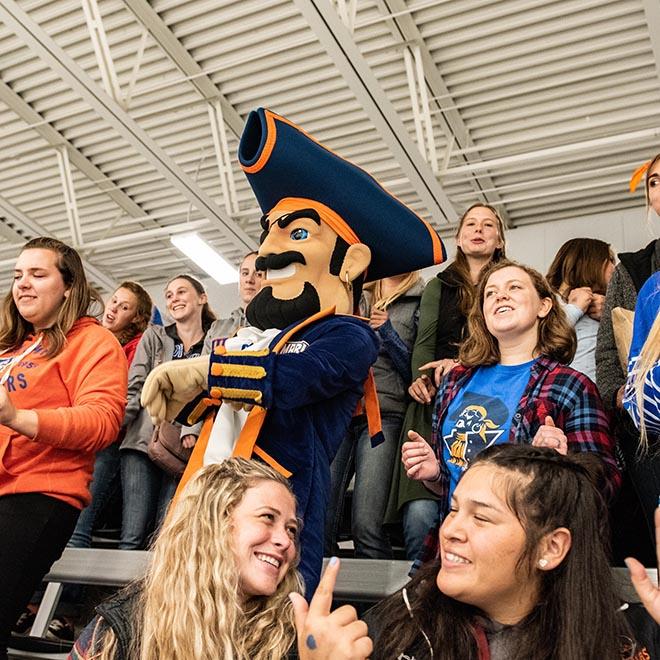 Max the Marauder in a crowd of students at a Marauders Athletics game.