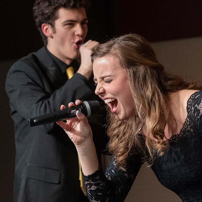 Female singer performing as part of a very popular and award-winning Vocal Jazz group at the University of Mary.