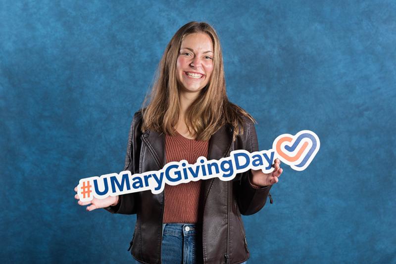 Clare Wilmes with #Umary giving day sign