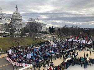 ​​​​​​​University of Mary contingent of 600 strong lead 2017 March for Life down Constitution Ave in DC with U.S. Capitol in background