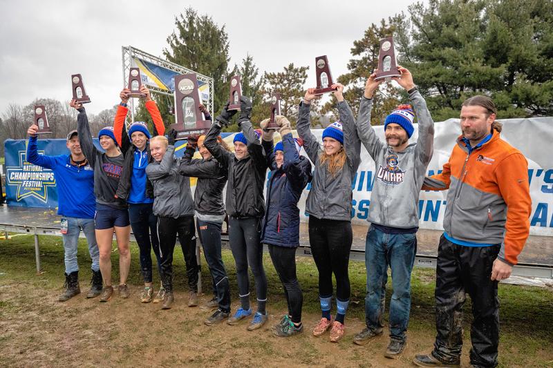 NCAA D2 Cross Country National Championship Team Raising Trophies