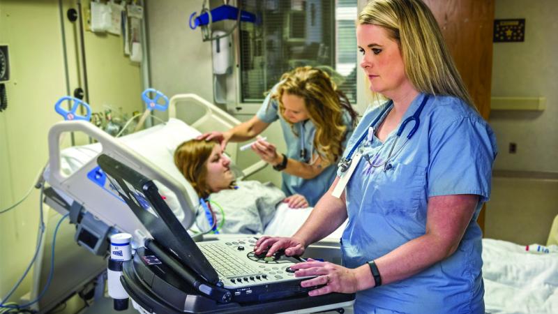 Nurses working with a patient