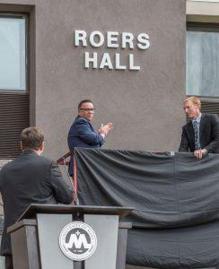 Monsignor James Shea, president of the University of Mary, looks on as the name of the new all-female residence hall on campus is revealed.