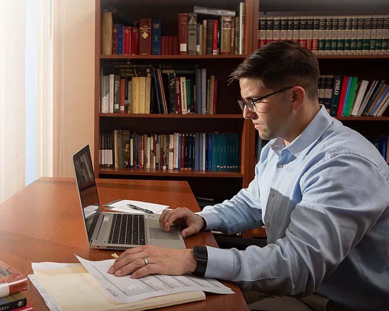 Collin studying in an office