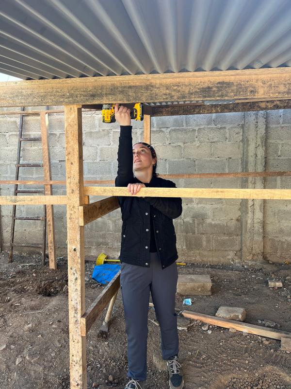 Student working on building a Chicken Coop