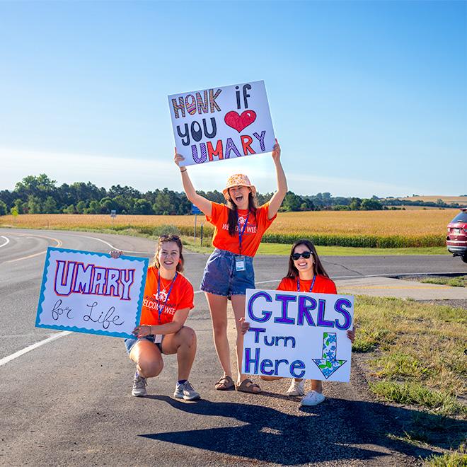 Students welcoming new students on campus