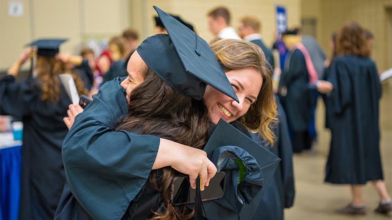 Students after graduation in their gowns.