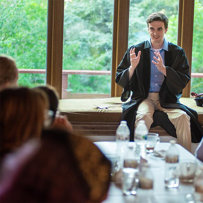 students having a debate at the Catholic Studies House.