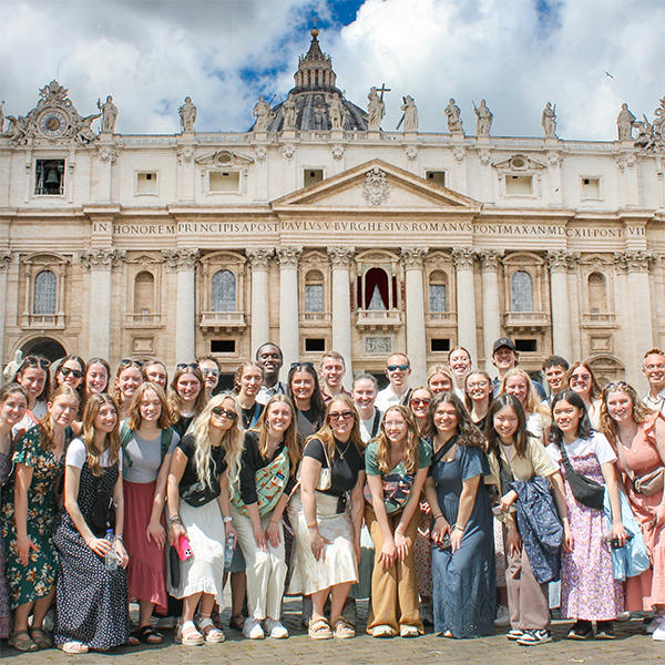 students standing in front of the vatican.