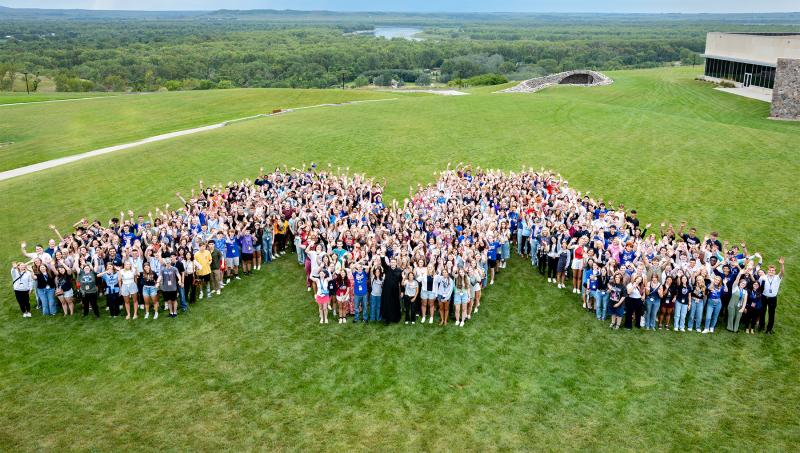 Freshman class of 2025 standing in the M 