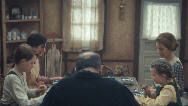 the family sitting around the dinner table