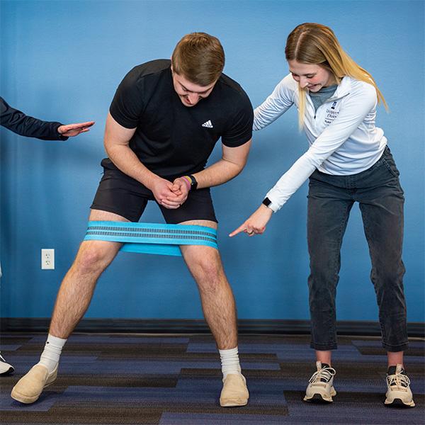 students practicing with strength bands