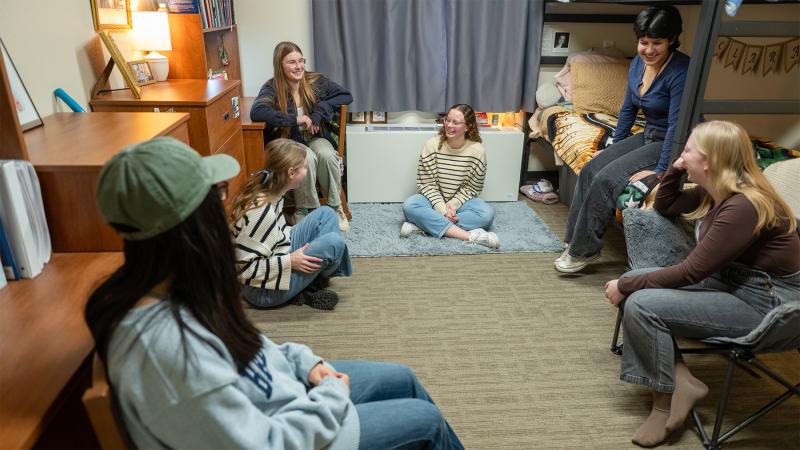 students in their residence hall rooms hanging out
