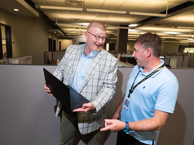 Doug working with an employee