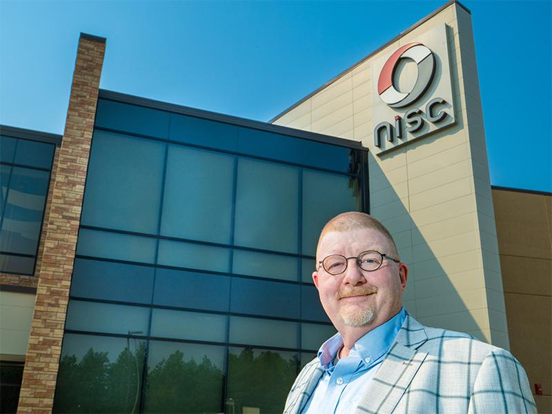 Doung standing outside NISC