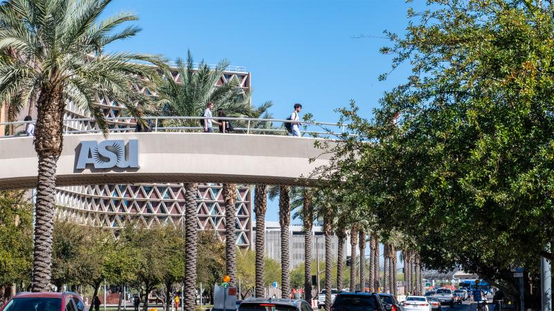 Students on a walkway bridge at ASU campus