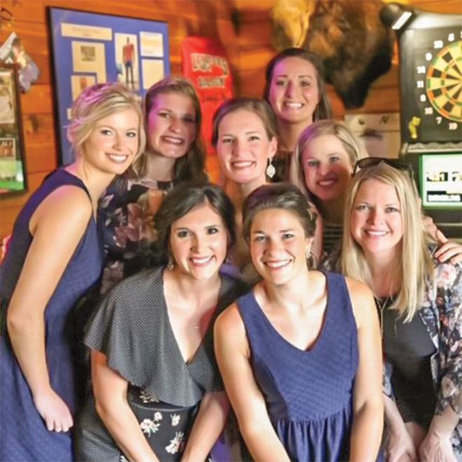 The PT Alumni group together for a wedding.