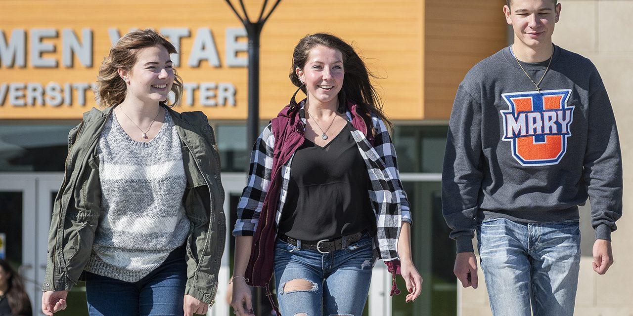 Girl walking with two friends