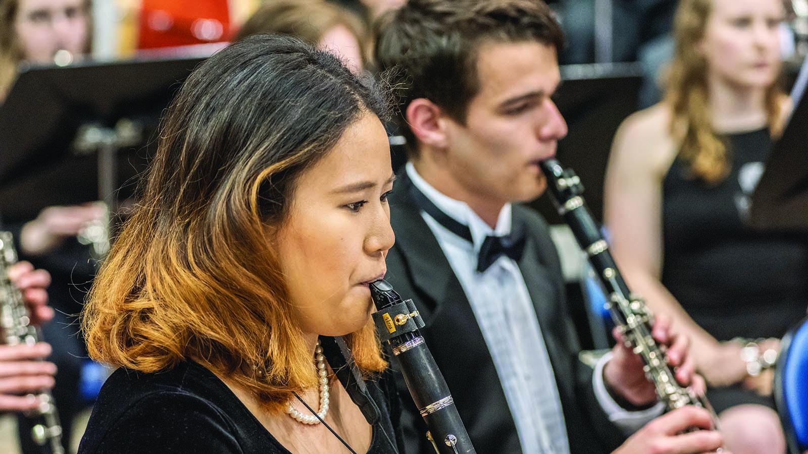 Clarinet players playing in concert band