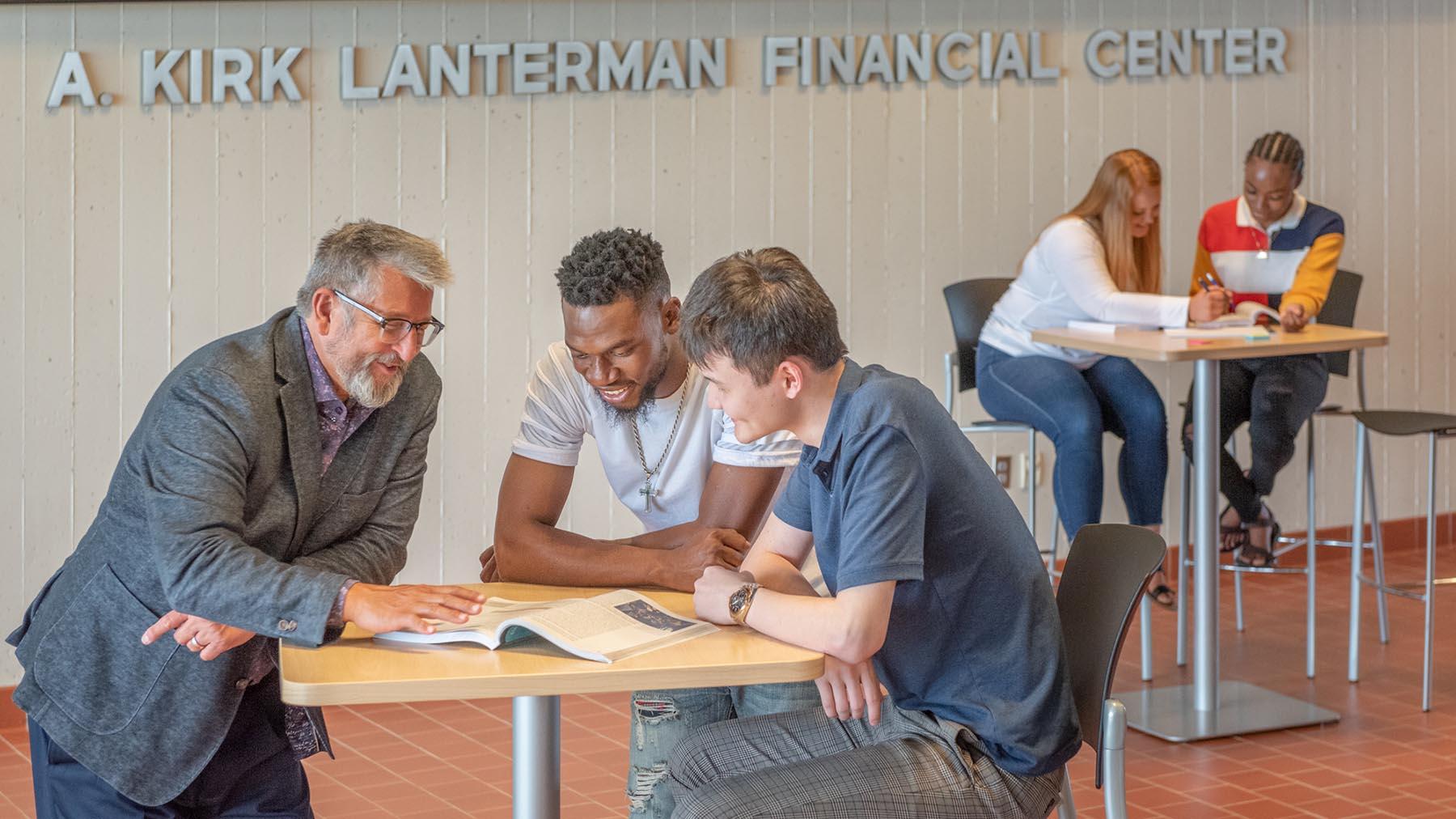 Business students meeting with Dean of the School of Business