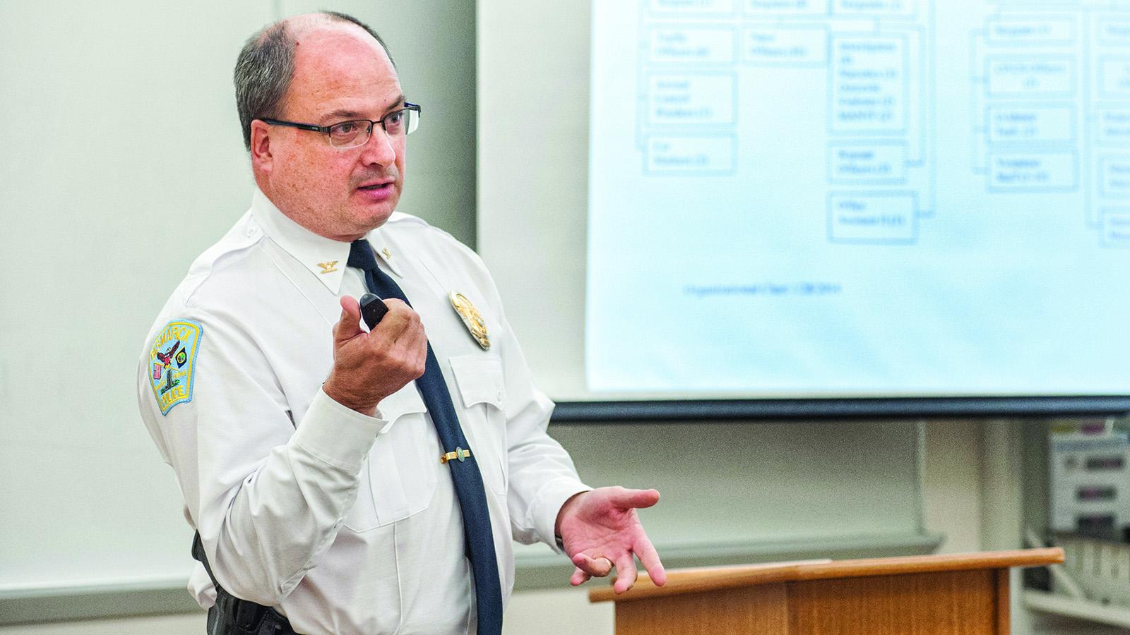 Police chief presenting to criminal justice class