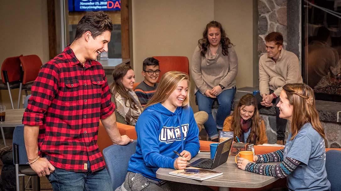 Laughing students in the Crow’s Nest Campus Restaurant 