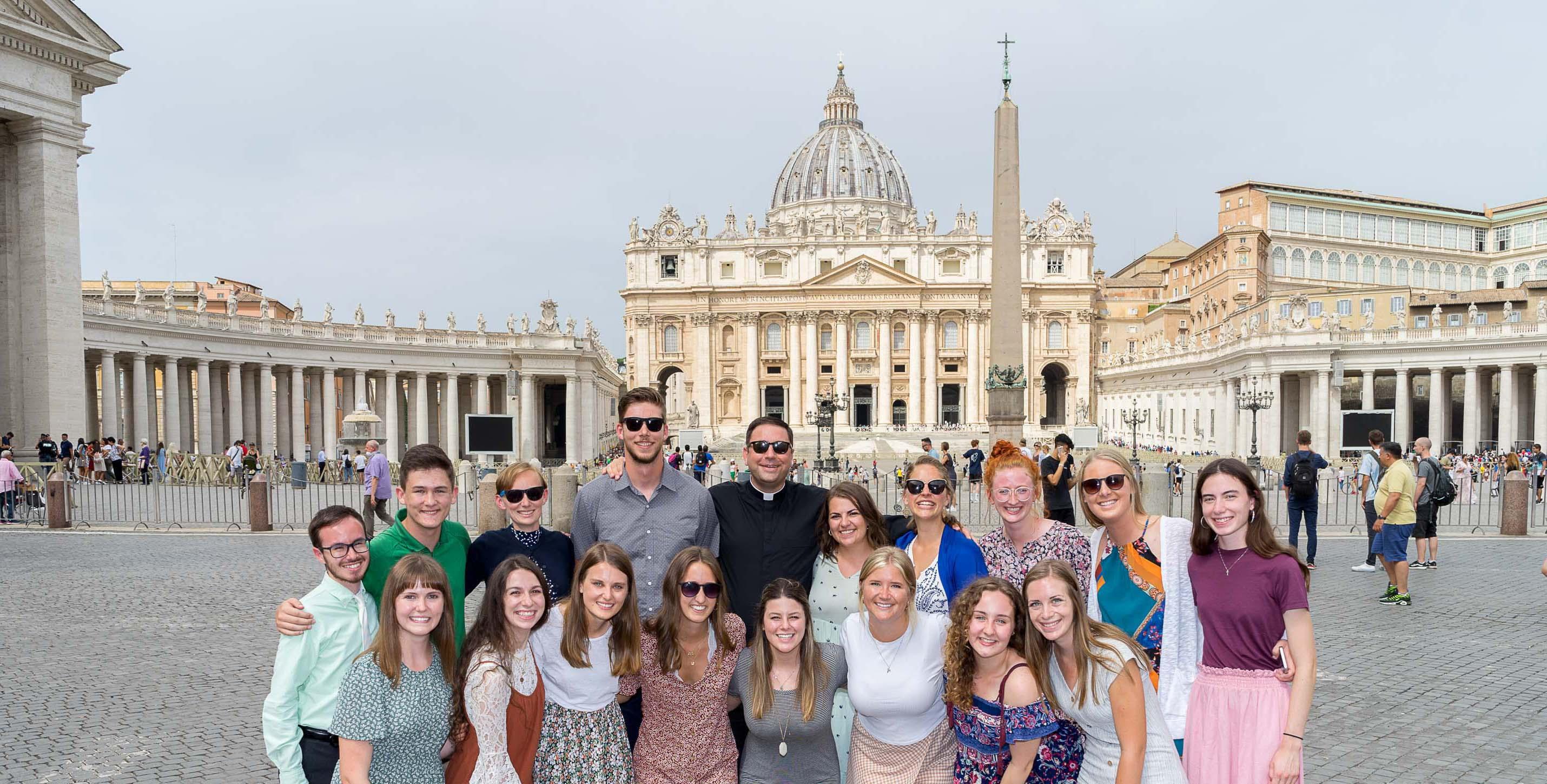 Smiling students in front of St. Peter's Basilica