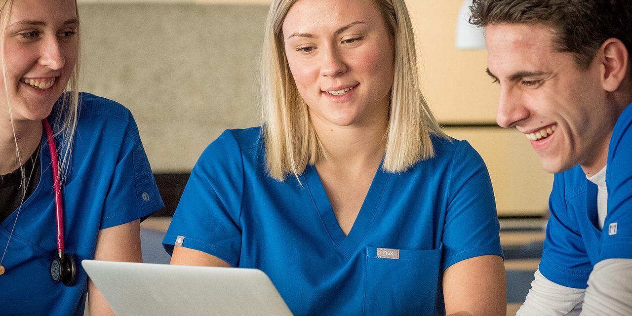 Kelly Danielson working with fellow University of Mary nursing classmates.