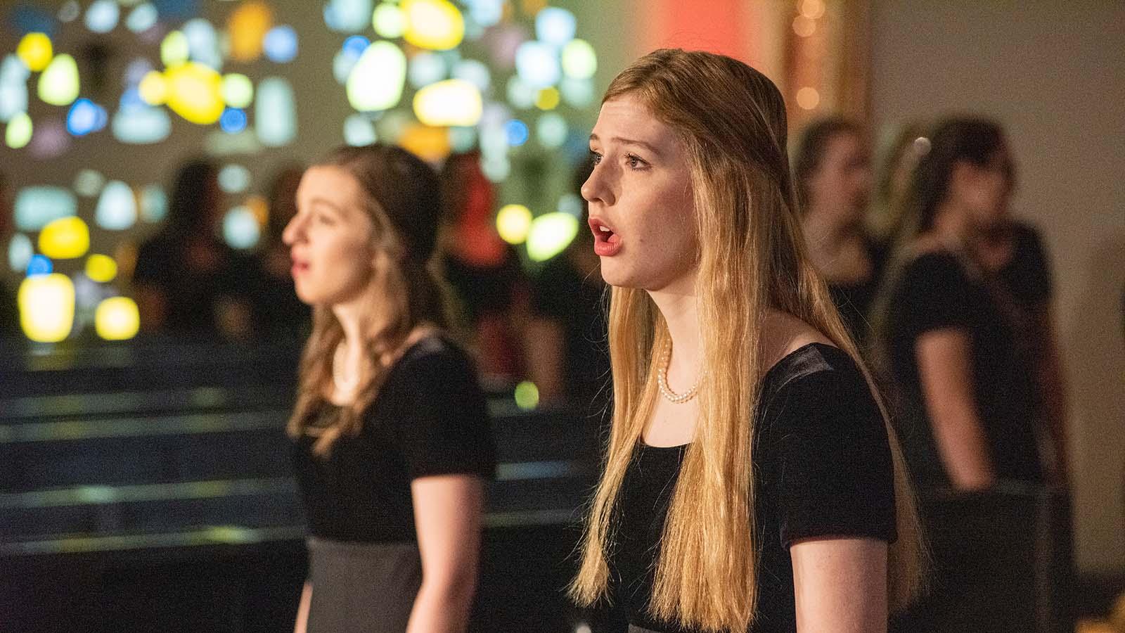 Two soloist performing in the Our Lady of the Annunciation Chapel at the annual Christmas at Mary concert