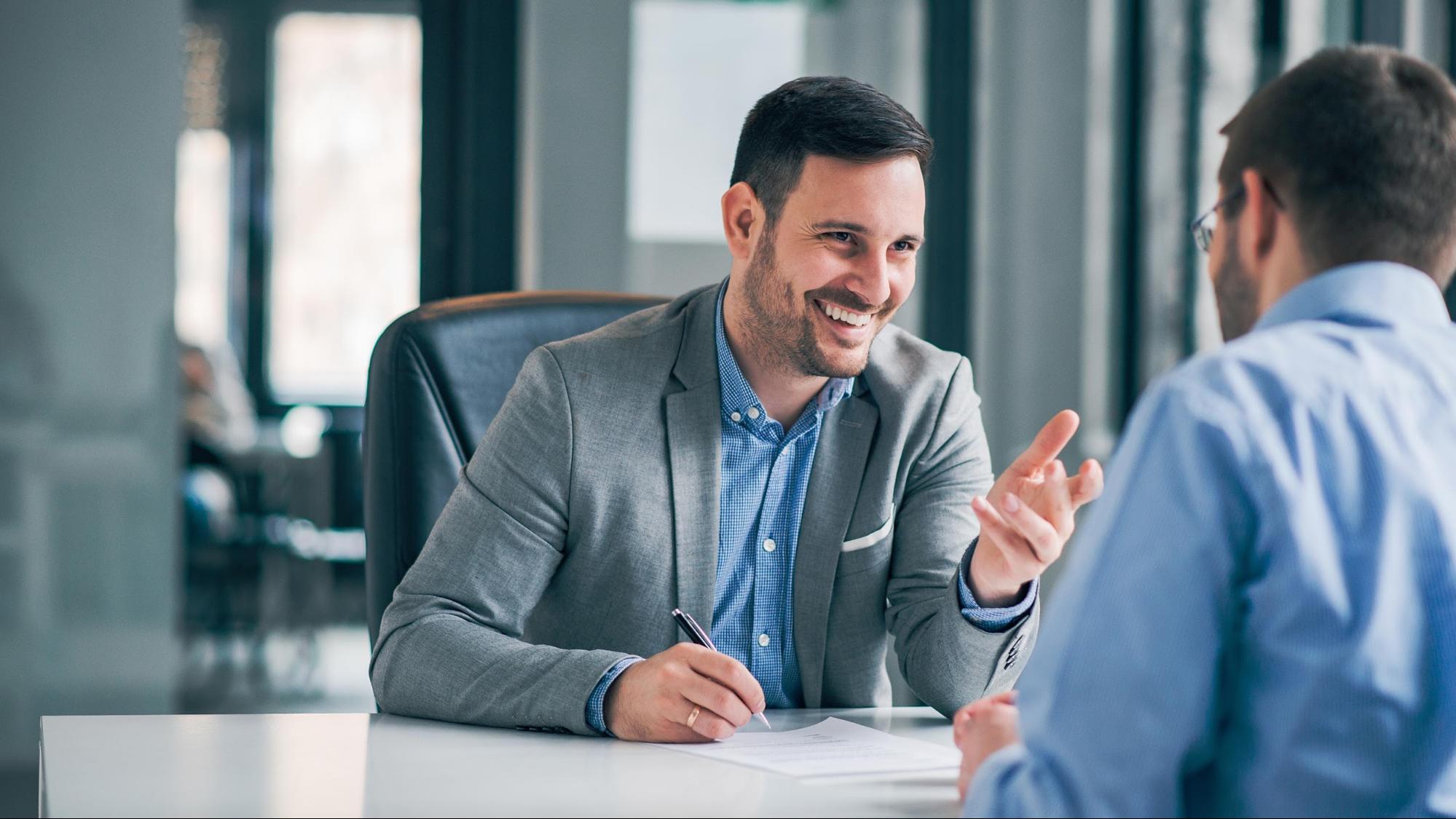 Smiling lawyer meeting with client