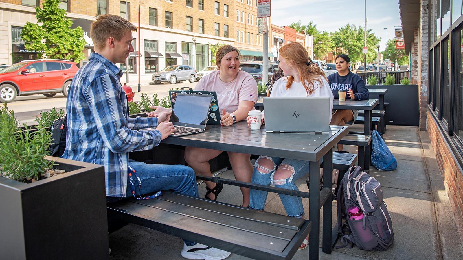 Four Year-Round Campus students studying at a downtown Bismarck business.