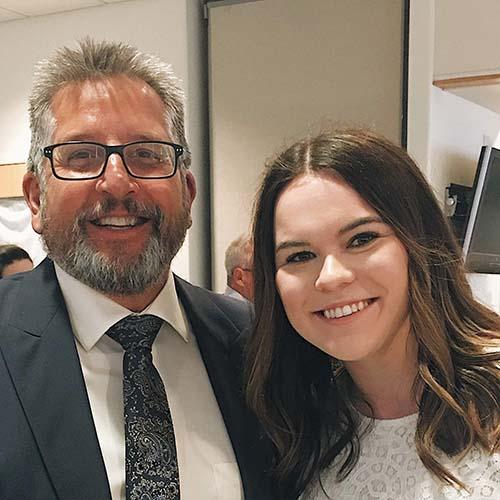 Dean of the School of Business Karel Sovak with Year-round Campus student Karly Palczewski.