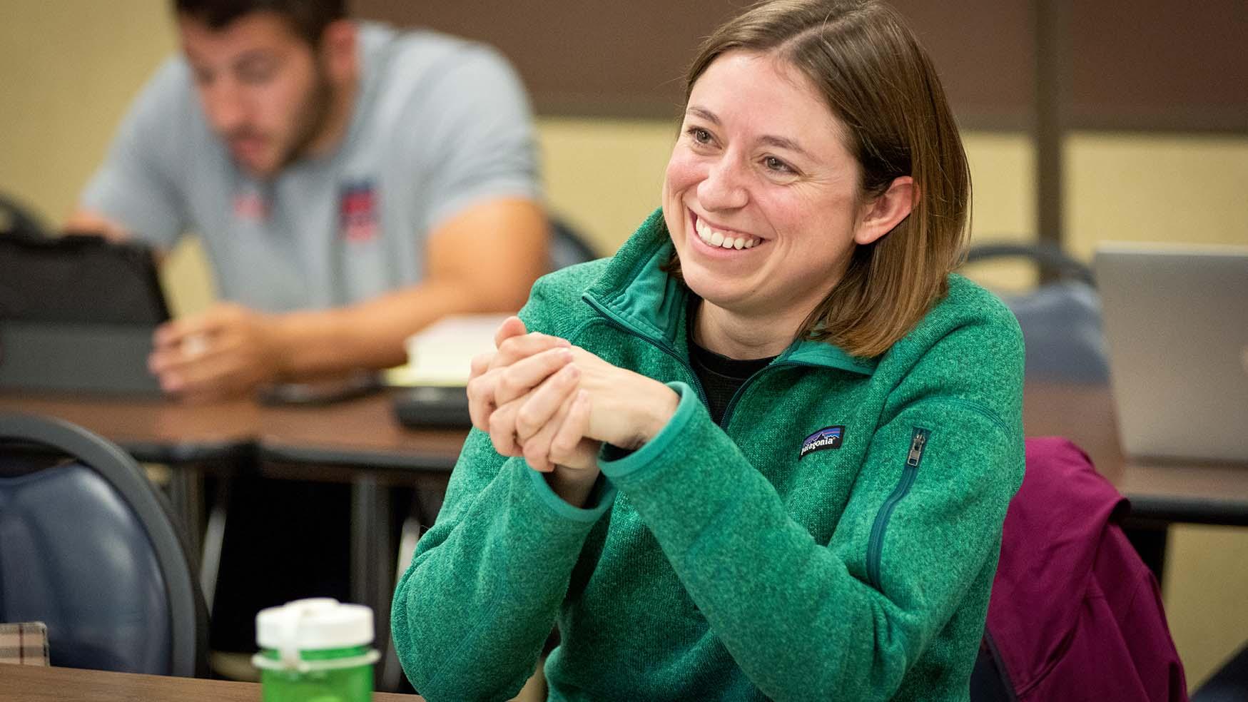 Smiling adult student attending evening class