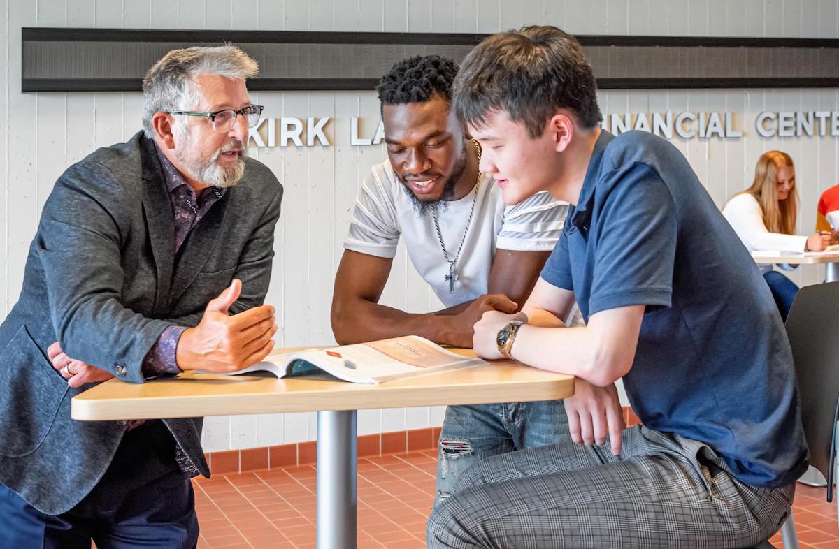 Professor talking with two students