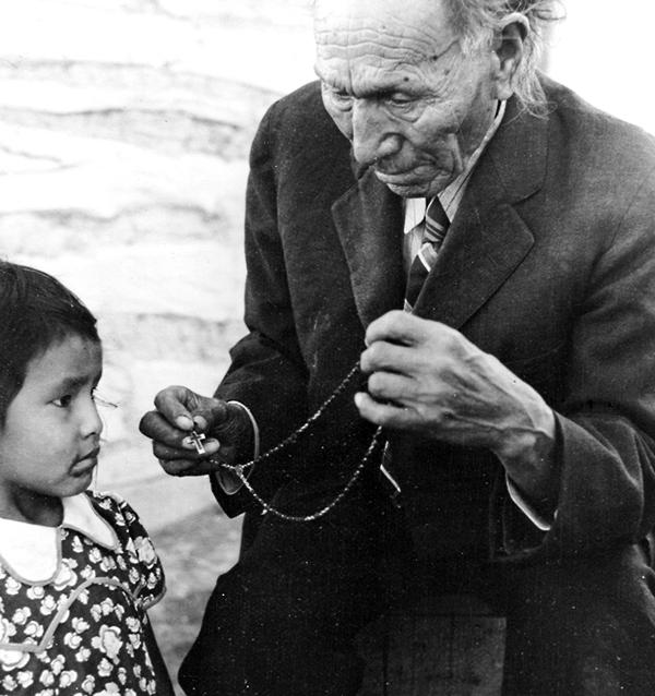 Archived Black and white image of Black Elk with a Child