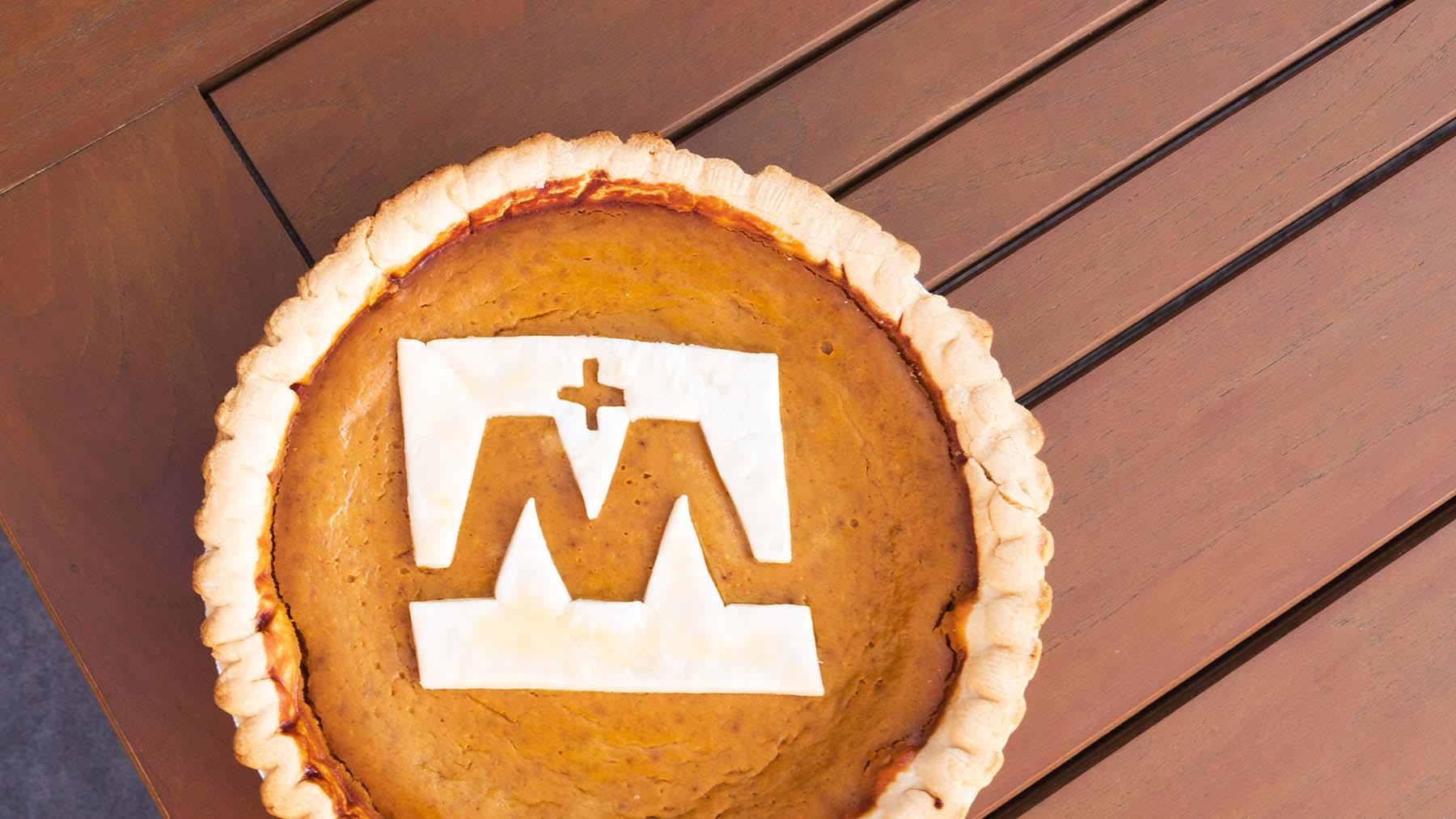 A Pumpkin Pie with the Mary Logo.
