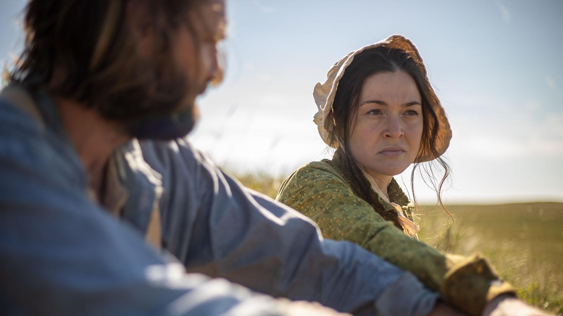 A prairie woman and man sitting