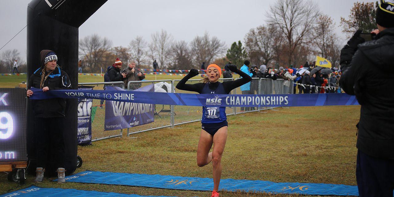 Female Track Runner at the finish line