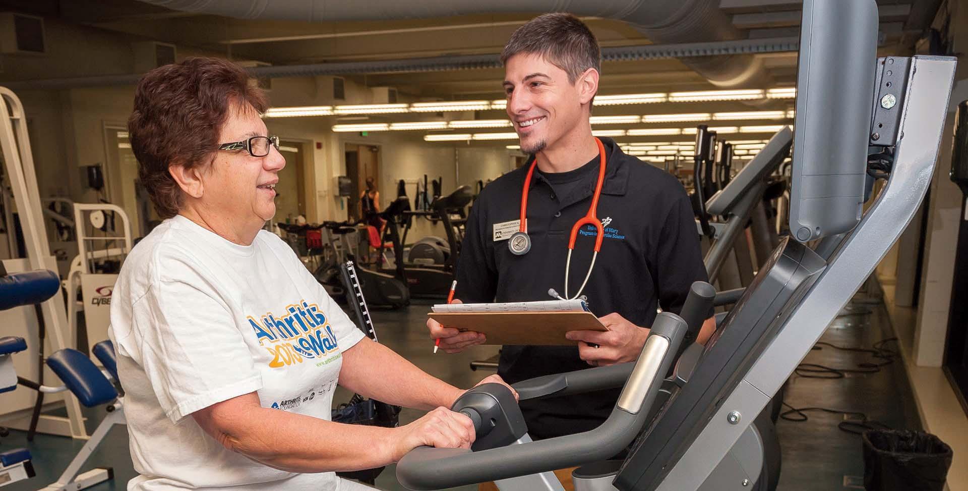 Exercise Science Student working with a patient