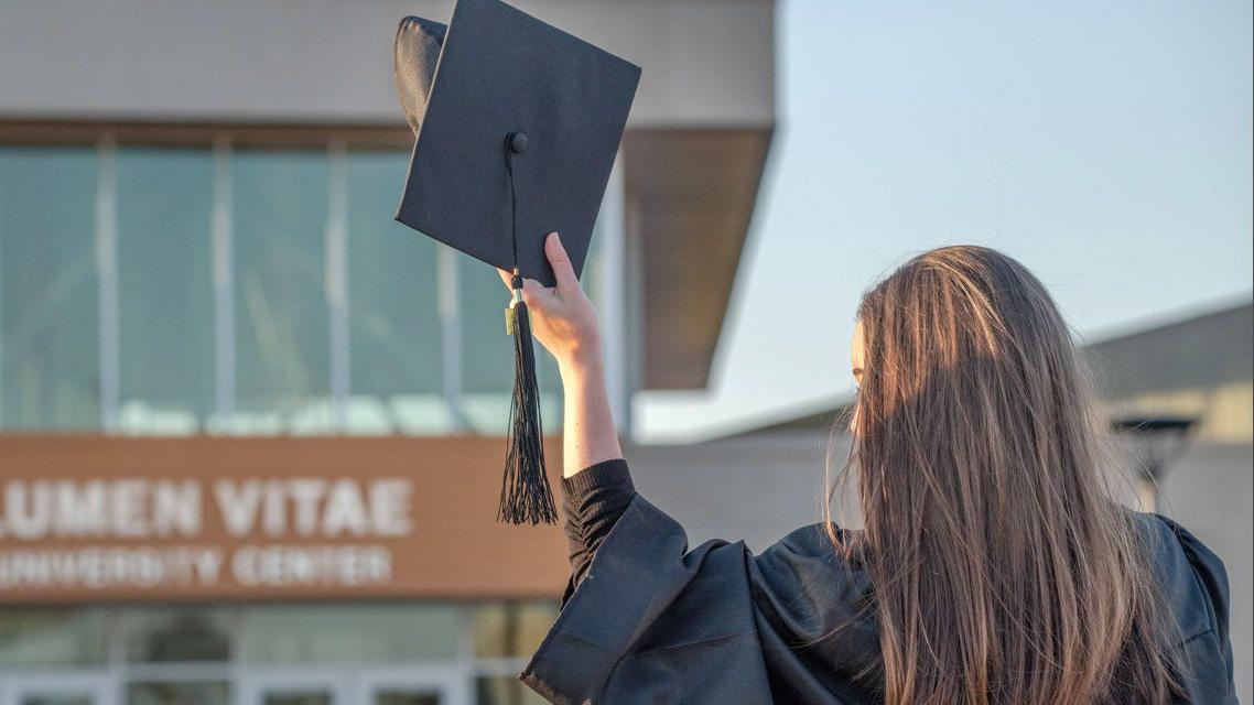 Back of graduate in cap and gown