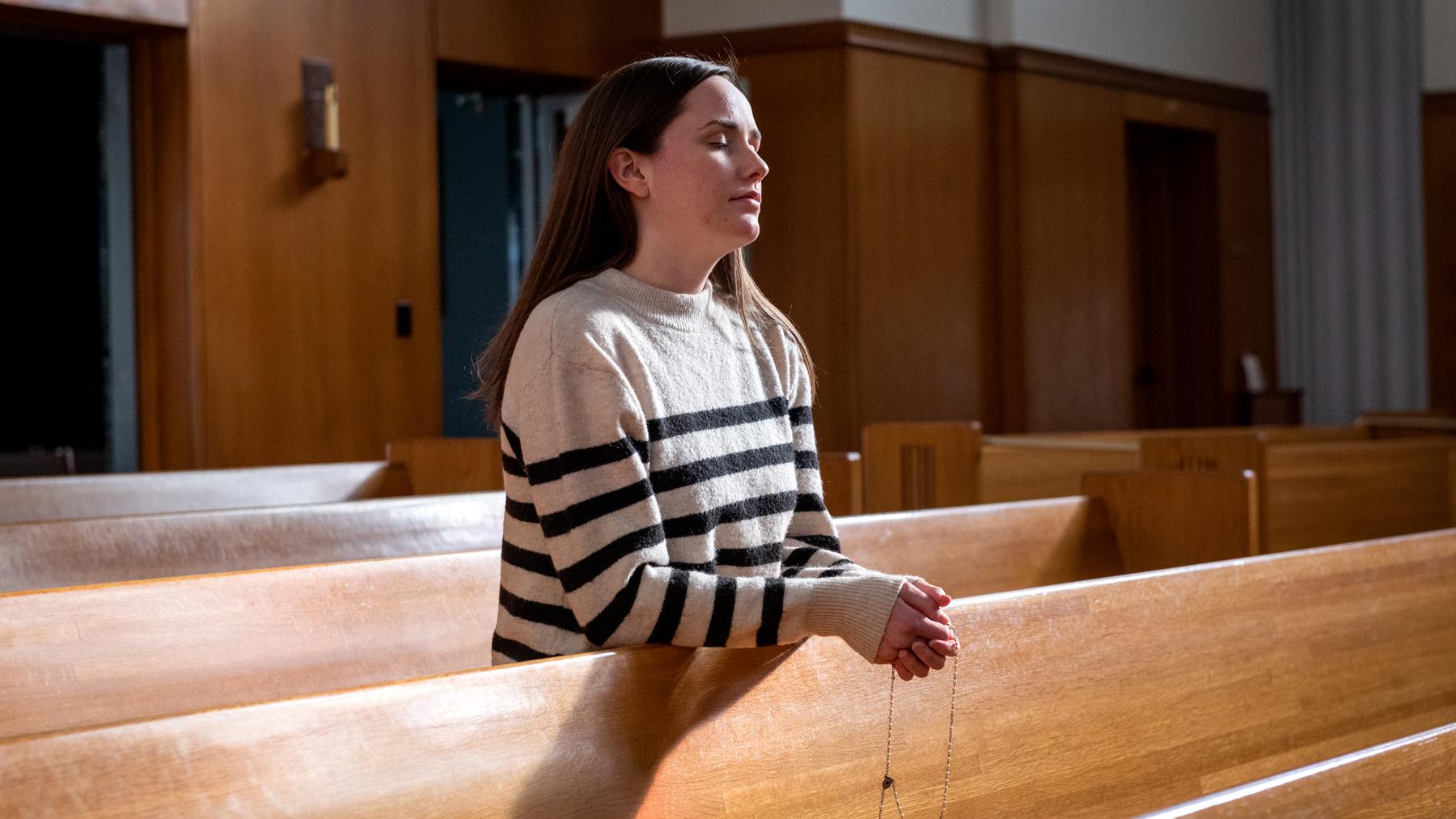 Allison praying at the Cathedral